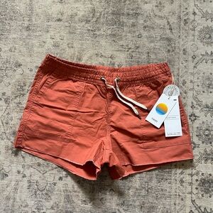 Vuori Women's Athletic Shorts in Rust